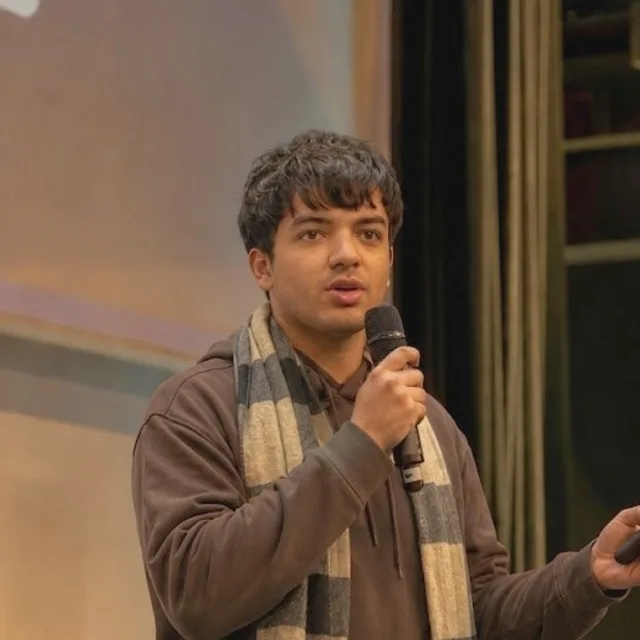 Aakshar Garg speaking at a conference